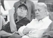  ?? Wally Skalij Los Angeles Times ?? JIM BUSS SITS with father Jerry during a 2011 news conference to introduce Mike Brown as coach.