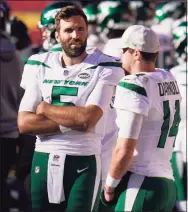  ?? Jeff Roberson / Associated Press ?? New York Jets’ Joe Flacco (5) and Sam Darnold (14) talk on the sideline late in the second half of an NFL game against the Kansas City Chiefs on Nov. 1 in Kansas City, Mo. The Jets are in a situation where neither quarterbac­k may be with the team next season.