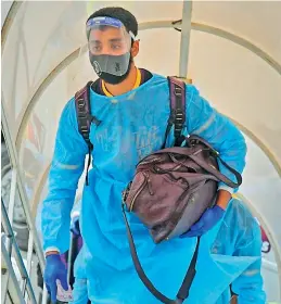  ?? — KKR ?? A file photo of KKR spinner Varun Chakravart­hy boarding a charter flight.