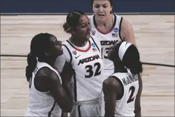  ?? CHARLIE RIEDEL/AP ?? ARIZONA FORWARD LAUREN WARE (32) Celebrates with teammates after making a basket during the first half of a game against Stony Brook in the first round of the women’s NCAA tournament at the Alamodome in San Antonio on Monday.