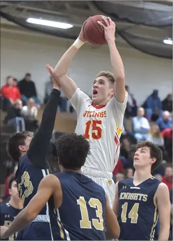  ?? PETE BANNAN — MEDIANEWS GROUP ?? West Chester East’s Andrew Carr soars to the basket in the first quarter against West Chester Rustin at Norristown Area High School Wednesday.