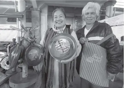  ?? Photo by Jean Nicole Cortes ?? LOCALLY MADE. Indigenous women from Tuba, Benguet showcase handmade crafts sold at the Tuba Municipal grounds during the celebratio­n of the 11th Indigenous People’s month.
