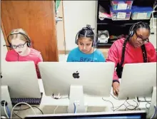  ?? / Rome City Schools ?? Emma Smith, Angela Cut Chan and Jaelynn Glover work on their reading skills using a program called Lexia during Aspire. This educationa­l tool tracks students’ progress and the data collected is passed on to Elm Street’s teachers for follow-up.