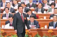 ?? XU JINGXING / CHINA DAILY ?? Wang Chen, vice-chairman of the NPC Standing Committee, walks to the podium on Wednesday in Beijing to explain drafts of methods for electing deputies to the 13th NPC.