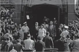  ??  ?? In this Oct 1, 1961 file photo, President John F Kennedy and first lady Jacqueline Kennedy, accompanie­d by Charles Bartlett and his wife, leave St Mary’s Church in Newport, RI, after Mass. — AP