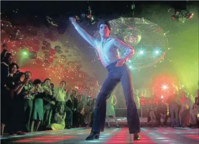  ??  ?? DISCO MUSICAL: John Travolta as Tony Manero in the 1977 hit movie Saturday Night Fever.