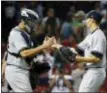  ?? MICHAEL DWYER — THE ASSOCIATED PRESS ?? Yankees’ Ben Heller, right, and Gary Sanchez celebrate after the Yankees defeated the Red Sox in 16 innings Saturday.