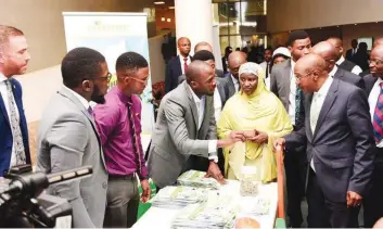  ??  ?? Governor, Central Bank of Nigeria (CBN), Godwin Emefiele (right), Special Adviser to the CBN Governor on Sustainabl­e Banking, Dr. Aisha Usman Mahmood, at the Visions Cape Polymer Recycling and Processing Exhibition stand, at the CBN 2018 World...