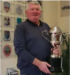  ??  ?? Tom pictured with a trophy named in his honour by the Galway FA