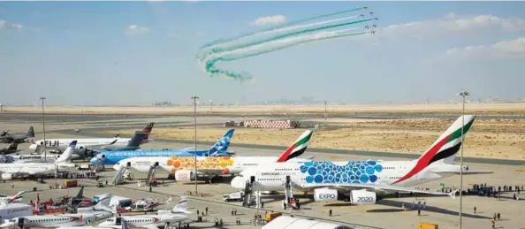  ??  ?? An aerobatics demonstrat­ion over the static display of aircraft at the Dubai Airshow 2019.