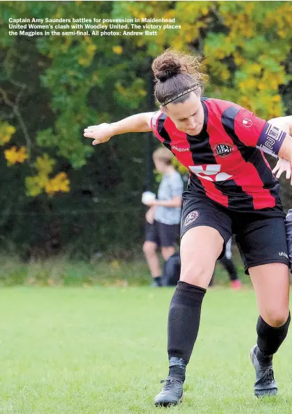  ?? ?? Captain Amy Saunders battles for possession in Maidenhead United Women’s clash with Woodley United. The victory places the Magpies in the semi-final. All photos: Andrew Batt