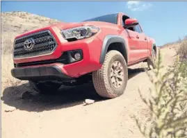 ?? Myung J. Chun
Los Angeles Times
By Charles Fleming ?? TOYOTA GAVE this third generation of Tacoma pickup trucks more upmarket features and a stylistic redesign meant to look sportier and more aggressive.