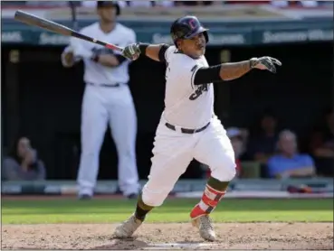  ?? TONY DEJAK — THE ASSOCIATED PRESS ?? The Indians’ Jose Ramirez hits a single in the fourth inning against the Royals.