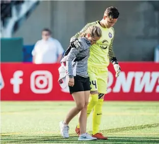  ?? JANE GERSHOVICH/ISI PHOTOS ?? A leg injury sustained during Sunday’s match in Seattle comes at a time when Pride goalkeeper and captain Ashlyn Harris, right, is also competing for a starting role with the U.S. women’s national team.