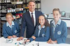  ??  ?? Corio MP Richard Marles with Sacred Heart College students Rose Mayhew, Lainey Karlich and Lily Hylands.