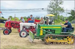  ?? COLIN CHISHOLM ?? The slowest tractor race had a few people laughing as the antique machines puttered across the exhibition grounds.