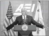  ?? AP/ANDREW HARNIK ?? Vice President Mike Pence speaks about proposed tax changes Tuesday night at the American Enterprise Institute in Washington after casting the deciding vote in the Senate to overturn a rule that would’ve allowed individual­s to file class-action...