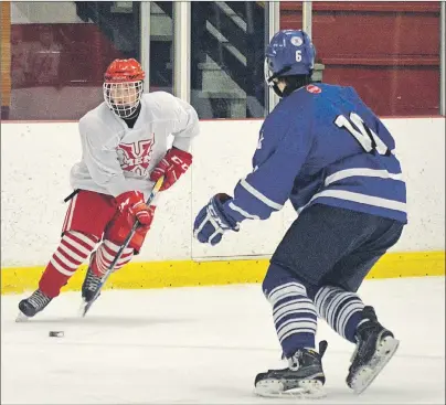  ?? JEREMY FRASER/CAPE BRETON POST ?? Dustin Sudds, left, of the Cape Breton County X-Men, prepares to make a move on Mark Bates of the Sydney Steelers during Cape Breton Midget X Hockey League at the Cape Breton County Recreation Centre on Friday. The X-Men won the game 6-4.