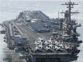  ?? — AP FILES ?? A U.S. navy aircraft carrier, the USS Carl Vinson, is leading an aircraft carrier strike group to provide a physical presence near the Korean Peninsula.