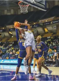  ?? STAFF PHOTO BY OLIVIA ROSS ?? UTC’s Raven Thompson shoots during Saturday’s win over East Tennessee State in a SoCon matchup at McKenzie Arena.