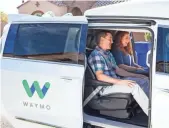  ?? WAYMO ?? People in Phoenix go for a test drive in a Waymo autonomous vehicle.