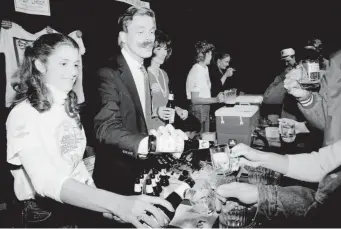  ?? Provided by the Brewers Associatio­n ?? Beer Marshalls pouring tastes for festival-goers in 1982.