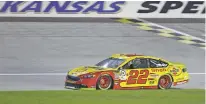  ?? ORLIN WAGNER/ASSOCIATED PRESS ?? NASCAR driver Joey Logano wins the pole position Friday during qualifying for Sunday’s race at Kansas Speedway in Kansas City, Kan.