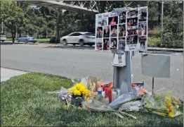  ?? Katharine Lotze/The Signal (See additional photos on signalscv.com) ?? A memorial sits near the site where Collin Gore and Joel Godfrey died in a headon collision on McBean Parkway near Decoro Drive Tuesday.