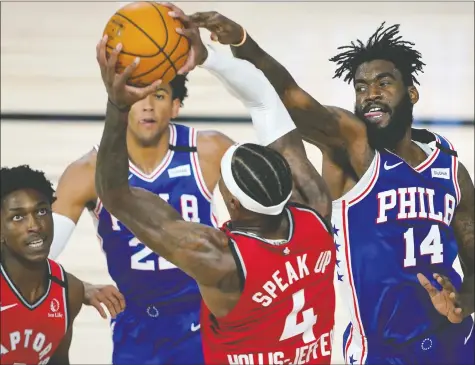  ?? — USA TODAY SPORTS ?? Raptors’ Rondae Hollis-Jefferson competes with 76ers’ Norvel Pelle for a rebound during last night’s game.