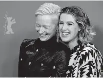  ?? AP PHOTO/GREGOR FISCHER ?? From left, actresses Tilda Swinton and Honor Swinton Byrne pose for photograph­ers during the photo-call for the film ‘The Souvenir’ at the 2019 Berlinale Film Festival in Berlin, on Tuesday.