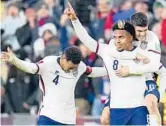 ?? JULIO CORTEZ/AP ?? United States’ Weston McKennie celebrates his goal with Tyler Adams, left, and Christian Pulisic during Friday’s World Cup qualifying match vs. Mexico.