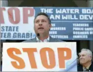  ?? RICH PEDRONCELL­I — THE ASSOCIATED PRESS ?? Assemblyma­n Adam Gray, D-Merced, speaks at a rally against a proposal by state water officials to increase water flows for the lower San Joaquin River to protect fish, at the Capitol, Monday, Aug. 20, 2018, in Sacramento, Calif. The State Water Resources Control Board is holding hearings this week concerning a plan to allow more water to flow freely down the Sacramento-San Joaquin River Delta from February to June, meaning less water will be available for farming and other needs.