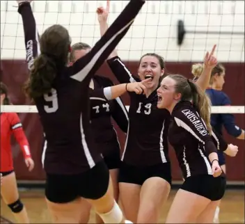  ?? JULIA MALAKIE — LOWELL SUN ?? Groton-dunstable’s Kaelyn Engeian (9) celebrates a point with her teammates during a 2022win over North Middlesex. An ACL injury has forced Engeian to change roles this season, from outside hitter to assistant coach.