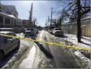  ?? MARC LEVY — THE ASSOCIATED PRESS ?? Crime tape stretches across a road near the scene of a shooting Thursday in Harrisburg, Pa. The mayor of Harrisburg said a U.S. marshal is dead after being shot while serving an arrest warrant in the city.