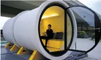  ?? VINCENT YU/THE ASSOCIATED PRESS ?? Architect James Law sits in an OPod tube house in Hong Kong’s industrial area of Kwun Tong.