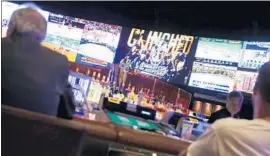  ??  ?? THE KNIGHTS’ game is broadcast at Caesars Palace. If the Knights win it all, some Vegas sports books could face large payouts to fans who made early wagers.