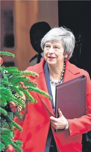  ?? PHOTO: PRESS ASSOCIATIO­N ?? Christmas wish: Mrs May leaves No 10 on her way to parliament