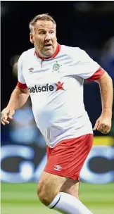  ??  ?? Having another go: Paul Merson in action during the Star Sixes football match between England and Spain at the O2 Arena in London on July 13 this year. He will next play for minnows Caerau in the Welsh League Three. — AFP