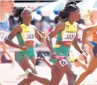  ?? GLADSTONE TAYLOR ?? Remona Burchell passes the baton to Shericka Jackson on the final exchange in the women’s 4x100 metres semi-final at the Tokyo 2020 Olympic Games, at the Tokyo Olympic Stadium in Tokyo, Japan, yesterday.