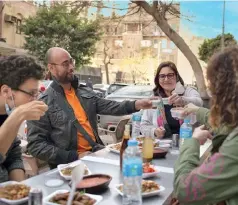  ?? ?? Laila Hassaballa, centre, leads an eating tour with her company Bellies En-Route.