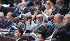  ?? FENG YONGBIN / CHINA DAILY ?? Above: Foreign diplomats attend the opening ceremony of the third session of the 13th National People’s Congress in the Great Hall of the People in Beijing on Friday.