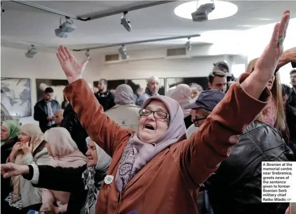  ??  ?? A Bosnian at the memorial centre near Srebrenica, greets news of the sentence given to former Bosnian Serb military chief Ratko Mladic