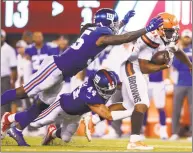  ?? Adam Hunger / Associated Press ?? Browns running back Nick Chubb ( 31) is tackled by the Giants’ Mark Herzlich ( 44) during a preseason game on Aug. 9 in East Rutherford, N. J.