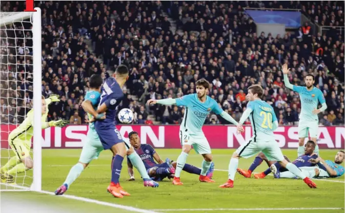  ??  ?? PARIS: Barcelona’s Andre Gomes, centre, and Barcelona goalkeeper Marc-Andre ter Stegen, left, save an attempt on goal during the Champion’s League round of 16, first leg soccer match between Paris Saint Germain and Barcelona at the Parc des Princes...