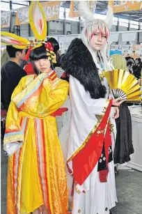  ??  ?? Fans at Comicup20 in Shanghai arrive dressed as characters from the popular mobile game Onmyoji.