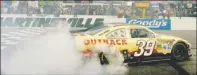  ?? By Sam Sharpe, US Presswire ?? Simply smokin’: Ryan Newman does a burnout Sunday after wining the Goody’s Fast Relief 500 at Martinsvil­le Speedway.