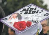  ??  ?? A Desert Academy student celebrates her graduation last month at the commenceme­nt ceremony.