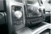  ??  ?? A modern, space saving transmissi­on knob shifts the class-unique eightspeed TorqueFlit­e automatic transmissi­on with mode selections for the 4X4 system located below. The centre instrument panel includes trailer gain brake sliders and ride height...