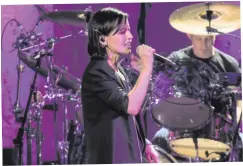  ??  ?? Stage presence: Dolores singing with The Cranberrie­s at the Waterfront Hall in Belfast last year, and (below) at the Sony Radio Academy Awards