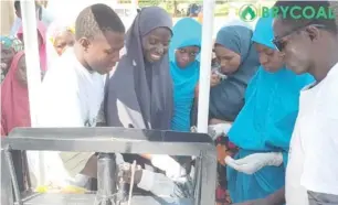  ??  ?? Members of the team train women on making brisquette­s from agro waste and making a living from it